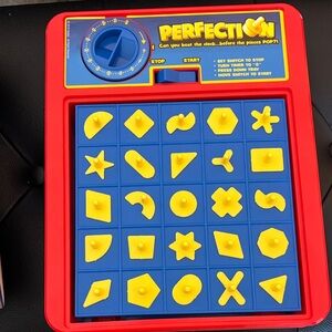 Hasbro Perfection Game - Red and Blue with Yellow Pieces